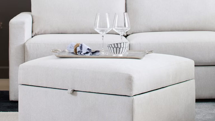 This ottoman offers hidden storage and a sleek design. It’s perfect for keeping your living room organized while doubling as a functional surface or extra seating.